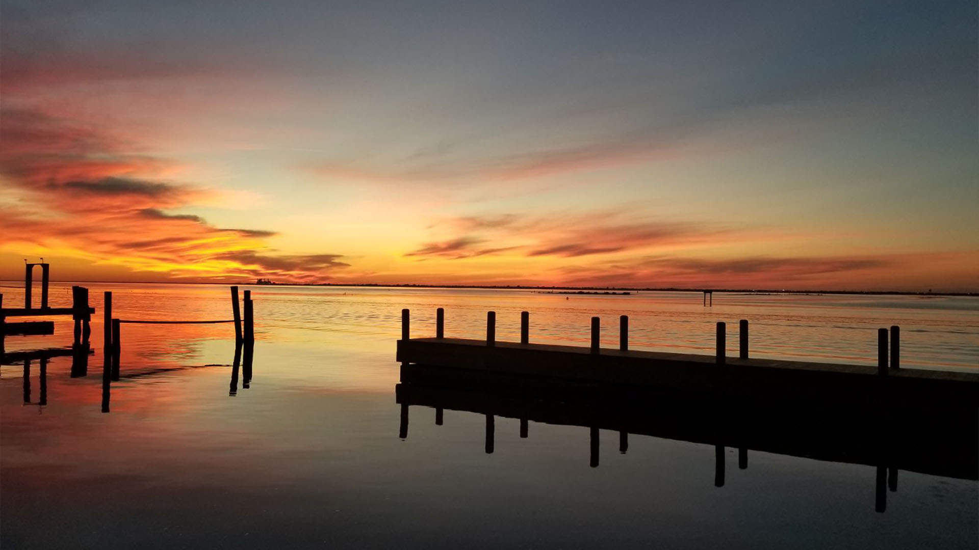 A sunset is pictured from a dock at Doc's Seafood & Steaks